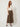 Brown wide-leg culotte pants - model three-quarter