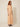 Orange chevron-pleated maxi dress - three-quarter view on model