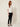 Nova Spring Blouse White on model - three-quarter view showing the boxy cut and embellished elbow sleeves