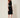 01333364 CHAIN CIRCLE BELT SILVER - three-quarter view on model, silver disc and ring chain belt over a black dress