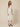 RM1528 white lady dress - three-quarter front view on model, white floral lace with beaded mandarin collar