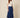 SR371 navy blue V pants three-quarter view on model - V waistband, welt pocket with flap panel, crinkled fabric