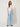 SR Light Blue Pants on model - three-quarter view showing the flat yoke and wide flowing legs