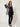 2354001 SILK DRESS TOP BLACK - three-quarter view on model, sheer open-front top with pleated satin cuff