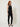 601570 BLACK FRINGE TOP - three-quarter view on model, draped cowl front, two-button tab and fringe hem