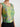 Green floral cropped top on model, studio