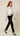 White floral embroidered sheer bomber jacket - side view on model