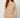 255403 ROSE PLEATED DRESS BEIGE - detail view of the round neckline, fine pleats and gold chain belt