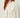 Three Piece Set White - detail of sequin floral vest with fabric-covered buttons under open blazer