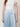 SR Light Blue Pants - detail of the flat curved front yoke, piped seam and pleats