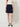 0133301310 Diba Navy Skirt — waistband and panel seam detail on model