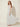 White Polka-Dot Halter Pleated Maxi Dress – three-quarter view