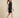 0133868 above-knee model detail - black embossed leaf-vein dress