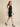 0133868 above-knee model detail - black embossed leaf-vein dress