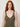 Olive shimmer knit top - close-up of floral applique straps and V-neckline