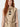 gold zhaponi vest — frog knot detail