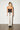 Black Draped Corset — back view on model showing the ribbon lace-up with long ends