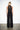 Endo Black Overall — back view on model showing the keyhole collar and disc mesh back