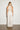 Endo Milk Overall — back view on model showing the keyhole collar and lace back