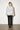 Elsa Rish Patineh White Coat — back view on model showing the fringed jacquard texture