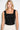 Close-up of black velvet boteh paisley brocade with delicate bead accents, square neckline and wide strap