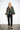 Maya Green Crocodile Coat — front view on model showing the folk tapestry pattern and wide pointed collar