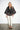 SR446 black cape jacket with metallic copper U-pattern — front view, shawl front tied in a knot at the waist