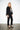 Elsa Rish Patineh Black Coat — three-quarter view on model showing the cropped silhouette
