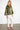 Maya Green Moth Coat — three-quarter view showing the A-line drape of the olive and lime-green brocade swing coat