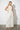 Endo Milk Overall — three-quarter view on model showing the wide-leg silhouette