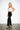 White Draped Corset — three-quarter view on model showing the ruched satin and boning