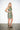 Lona Gray Abron Dress — three-quarter view on model showing the sleeveless cut