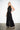 Endo Black Overall — three-quarter view on model showing the wide-leg silhouette