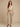 Kaira Beige Crinkle Jacket - model front view, buttoned, cream top